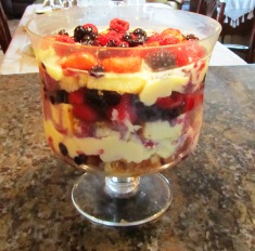Rum-flavored English trifle before adding dollops of whipped cream and nuts