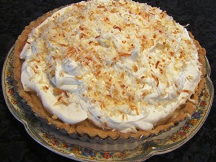 The coconut cream pie piled high with whipped cream and toasted coconut is always a hit for Christmas dessert