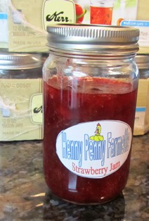 Last of the batch of strawberry jam gets canned even if the jar isn't full