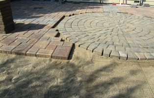 Getting the medallion correctly positioned followed after a few rows of stone were laid