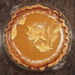 Our pumpkin pies feature leaves made from pie dough, brushed with egg, and sprinkled with sugar before baking