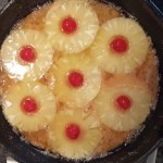 Before batter is added, the fruit is arranged in the cast iron skillet